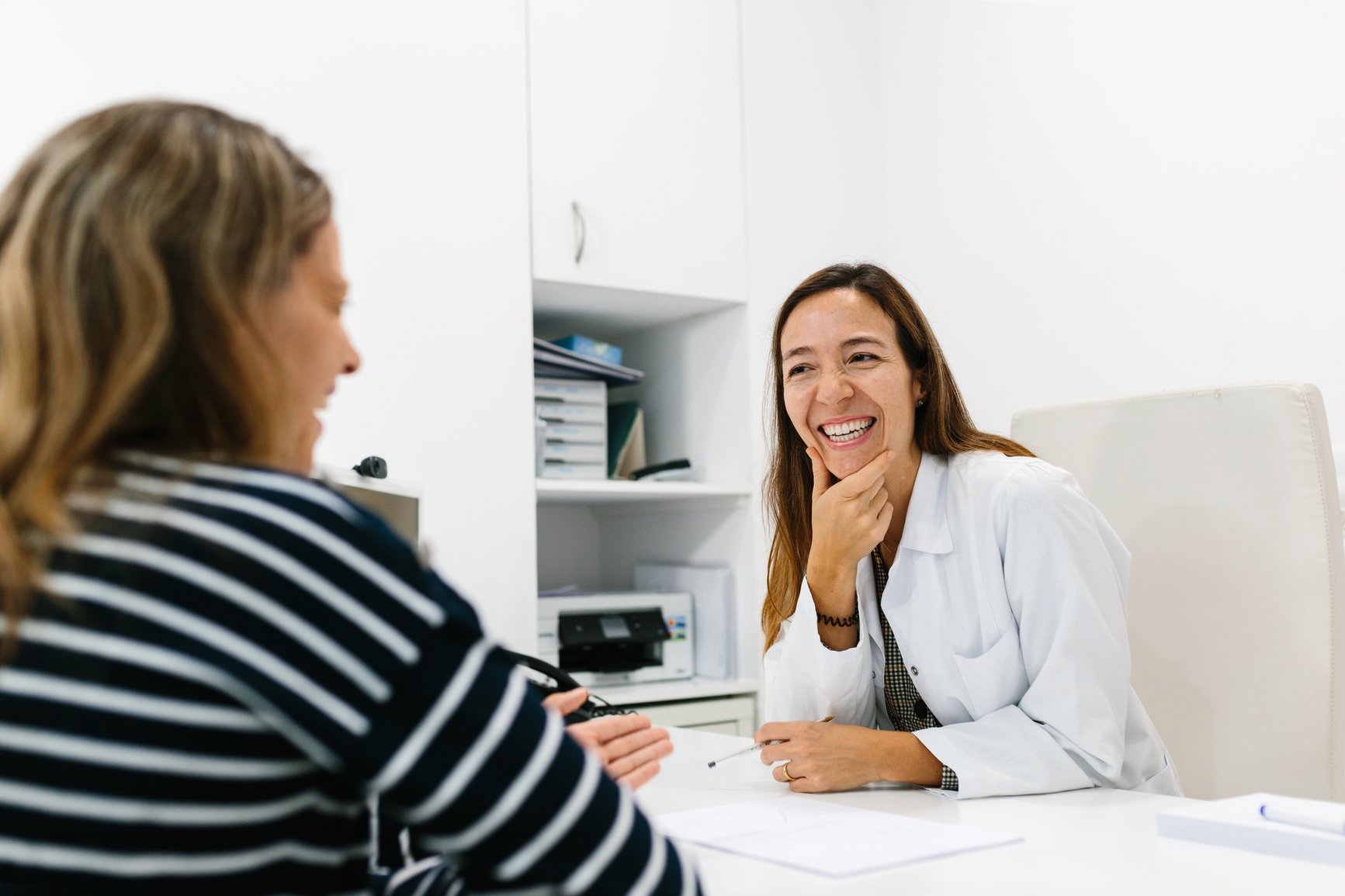Doctor laughing with patient